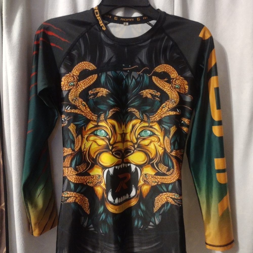 Roar Black and Gold Graphic Top